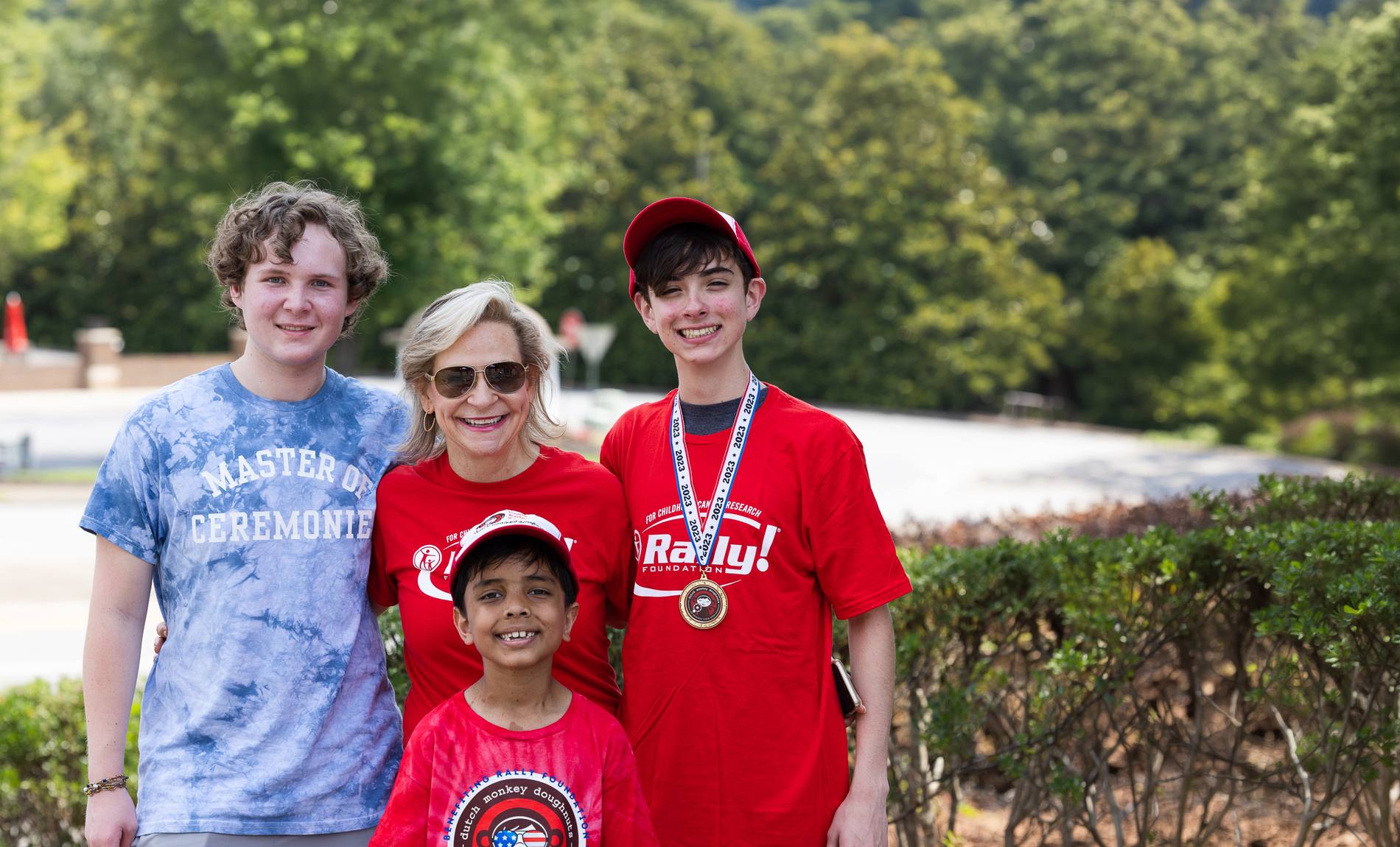 Rally Kids Ethan, Gideon and Kal with their mom at a Rally event