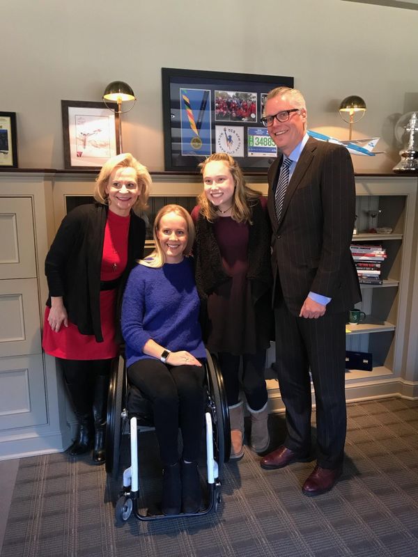 Rally Founder and CEO Dean Crowe, Paralympic swimmer Mallory Weggemann, Grace Bunke, and Delta CEO Ed Bastian.